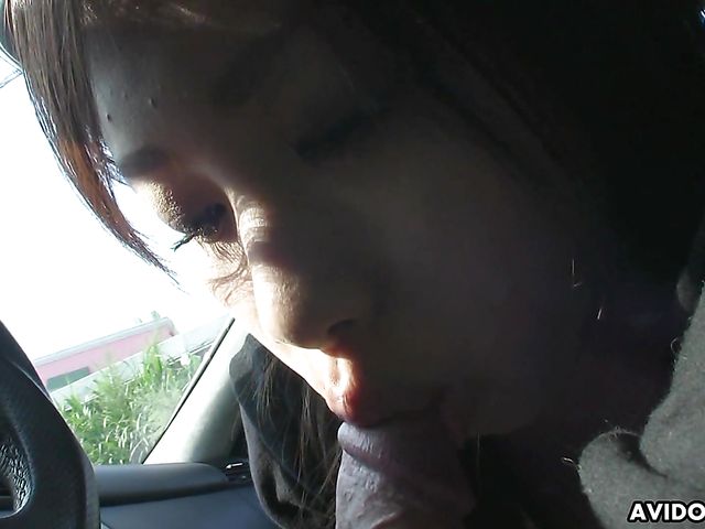 Japanese sweetie Karin Asahi gives a car blowjob 