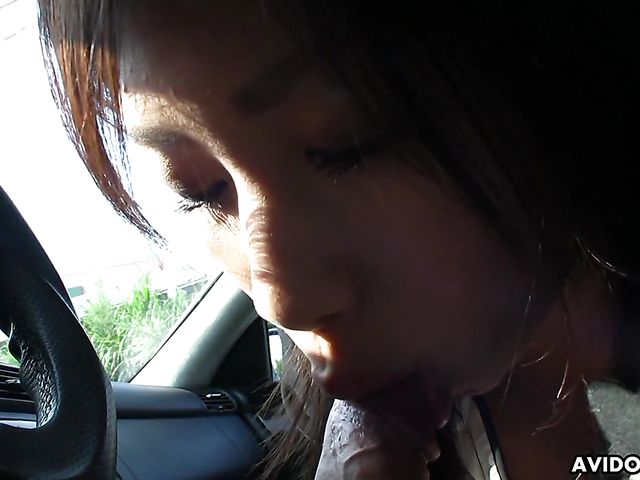 Japanese sweetie Karin Asahi gives a car blowjob 