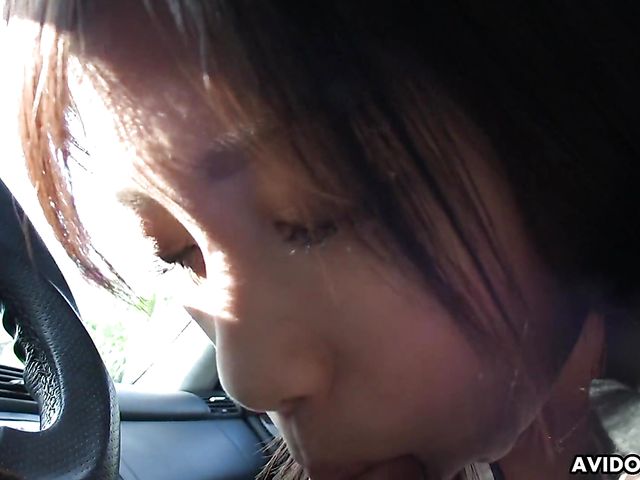Japanese sweetie Karin Asahi gives a car blowjob 