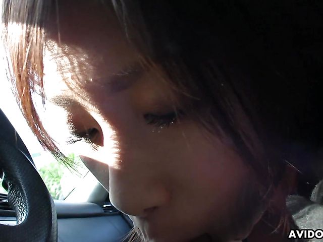 Japanese sweetie Karin Asahi gives a car blowjob 