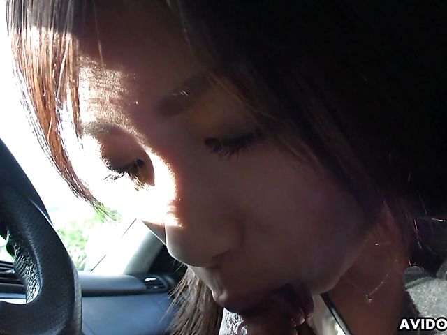 Japanese sweetie Karin Asahi gives a car blowjob 