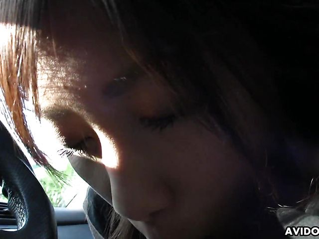 Japanese sweetie Karin Asahi gives a car blowjob 