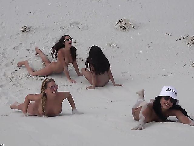 Four sexy nude girls play in the dunes 
