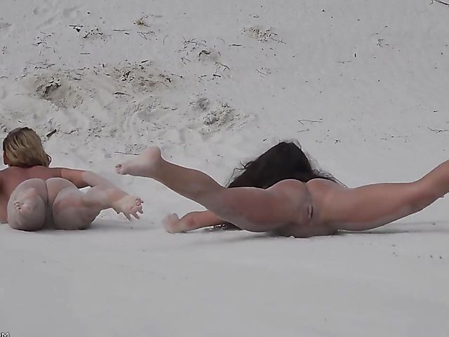 Four sexy nude girls play in the dunes 