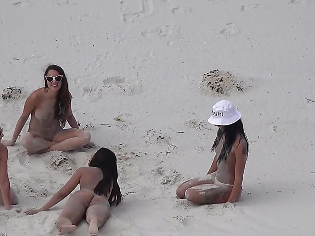 Four sexy nude girls play in the dunes 