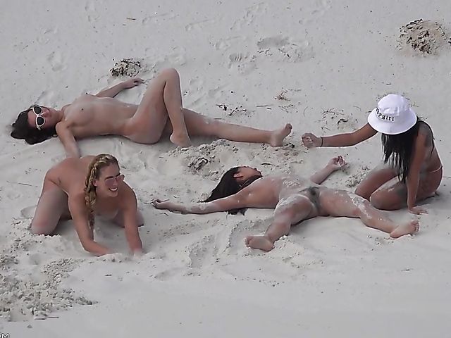 Four sexy nude girls play in the dunes 