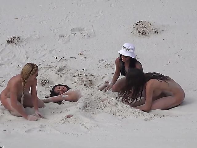 Four sexy nude girls play in the dunes 