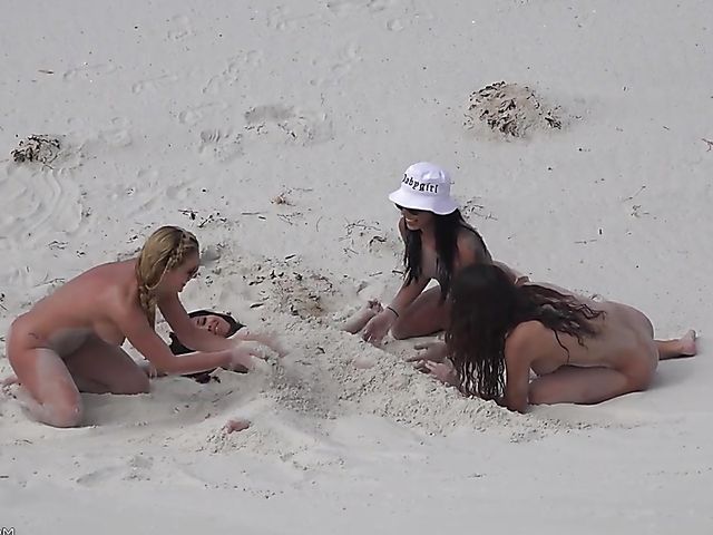 Four sexy nude girls play in the dunes 