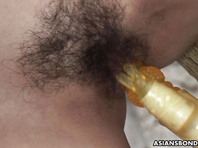 Japanese slave gets tied to a tree and toy fucked