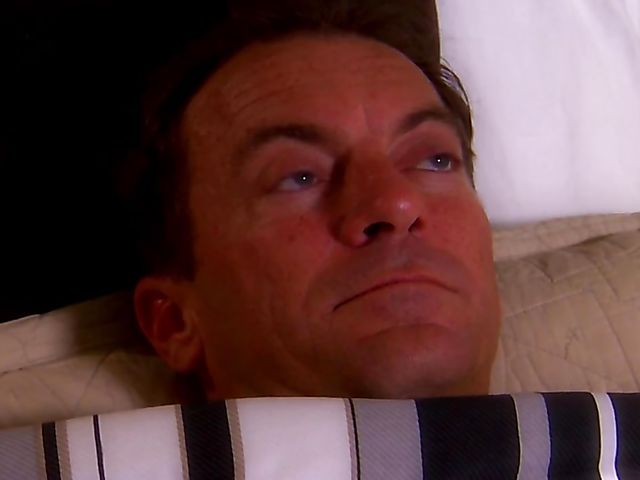 Carmen Hart in black boots and lingerie rides a cock in bed