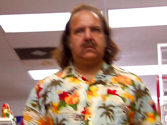 Carmen Hart in black boots and lingerie rides a cock in bed