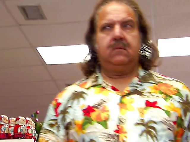 Carmen Hart in black boots and lingerie rides a cock in bed