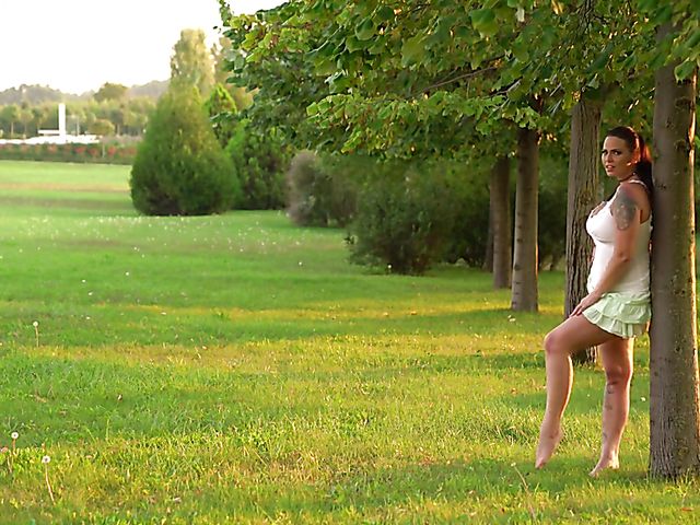 Busty euro MILF  Simony Diamond gets nude in the park 