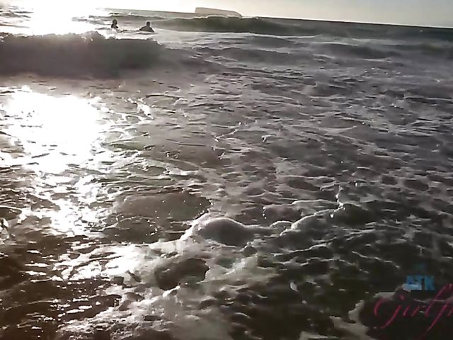 Hairy girlfriend Niki Snow is naked on the beach