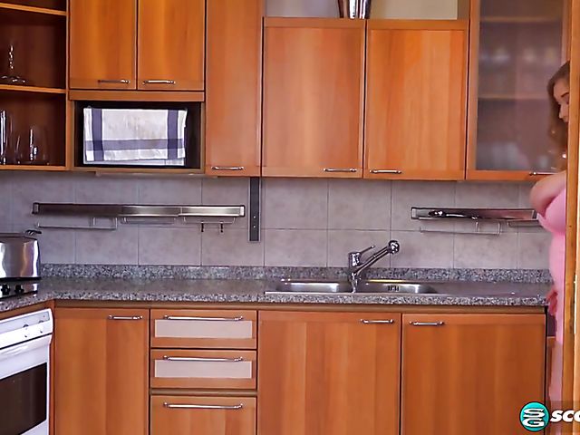 Curvy Cheryl Blossom plays with her monster tits in the kitchen