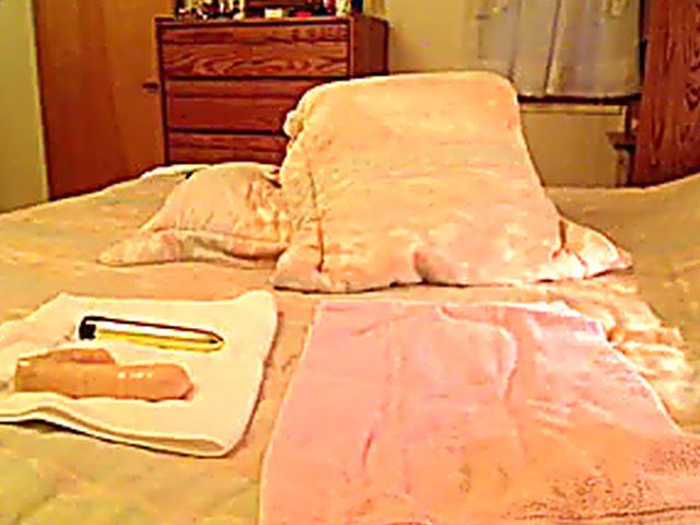 Blonde granny plays with her shaved pussy