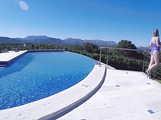 Maria Body displays her oiled massive tits by the pool