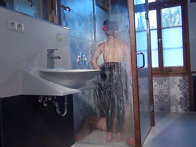 Female domination and latex worship in the shower with dominatrix Susi