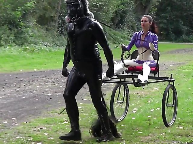 Human pony training outdoors with Mistress Susi's rubber slave