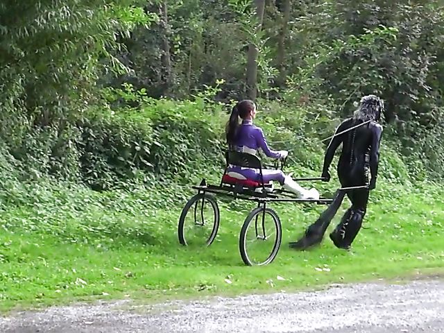 Human pony training outdoors with Mistress Susi's rubber slave