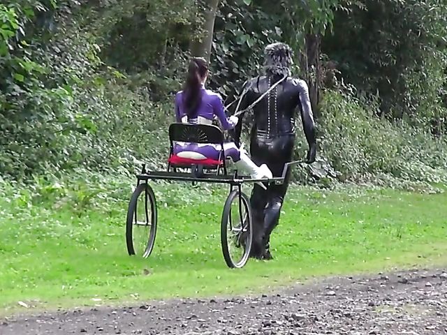 Human pony training outdoors with Mistress Susi's rubber slave