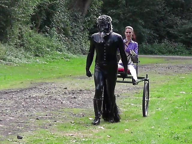 Human pony training outdoors with Mistress Susi's rubber slave