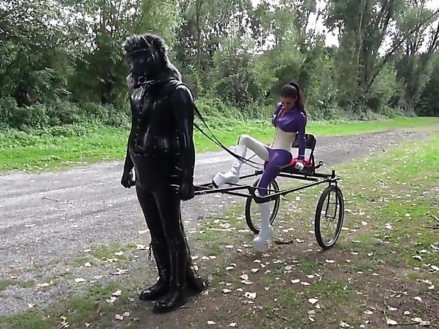 Human pony training outdoors with Mistress Susi's rubber slave