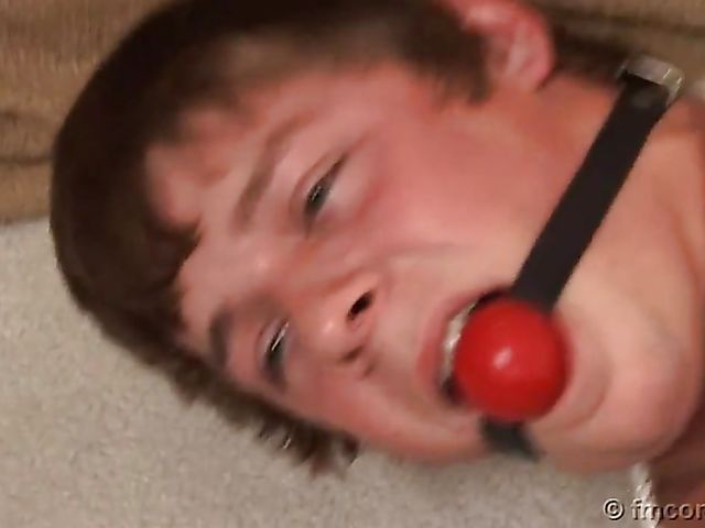 Guy tied up and ball gagged by his leggy mistress in a mini skirt