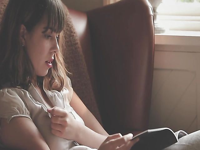 Erotic solo with bookworm Daisy Steel fingering and vibrating her snatch in her chair