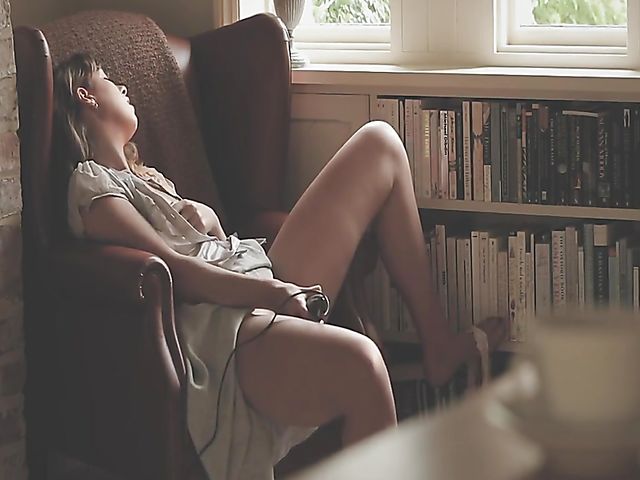 Erotic solo with bookworm Daisy Steel fingering and vibrating her snatch in her chair