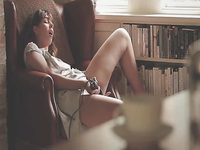 Erotic solo with bookworm Daisy Steel fingering and vibrating her snatch in her chair