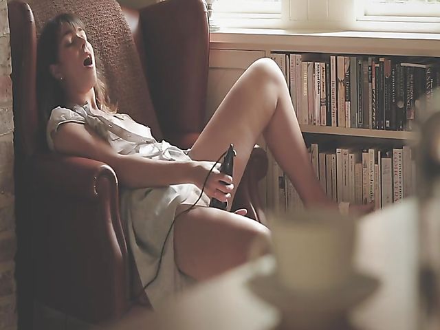 Erotic solo with bookworm Daisy Steel fingering and vibrating her snatch in her chair