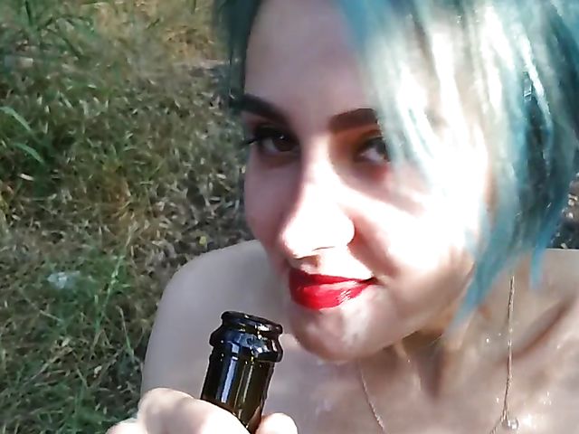 Champagne bottle insertion outdoors on a picnic  