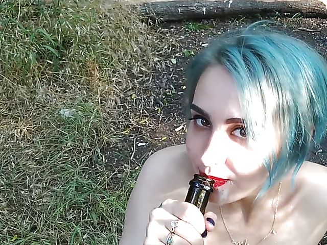 Champagne bottle insertion outdoors on a picnic  