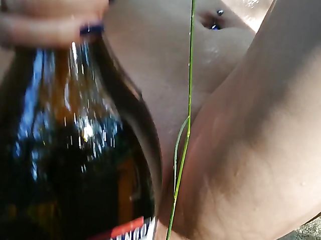 Champagne bottle insertion outdoors on a picnic  