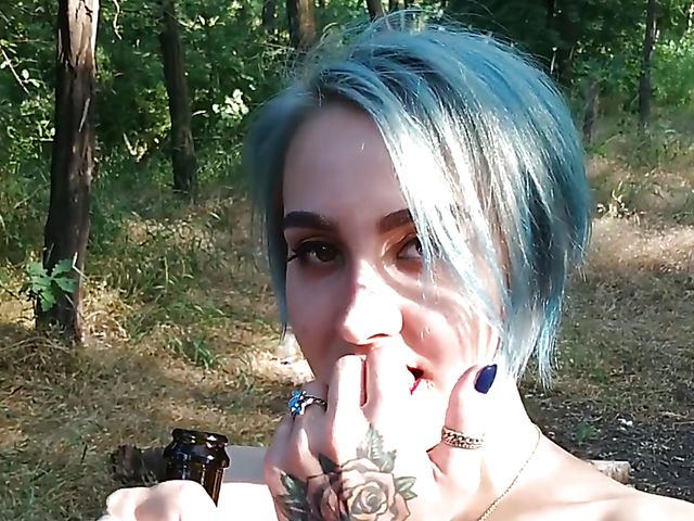 Champagne bottle insertion outdoors on a picnic  