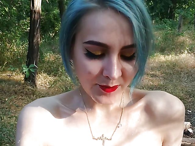 Champagne bottle insertion outdoors on a picnic  