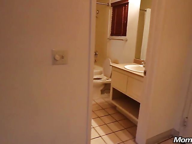 Bikini-clad black MILF Leyona fucks a white one