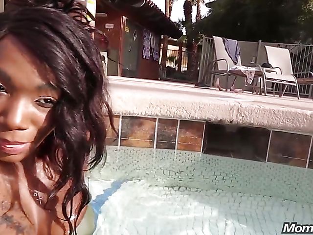 Bikini-clad black MILF Leyona fucks a white one