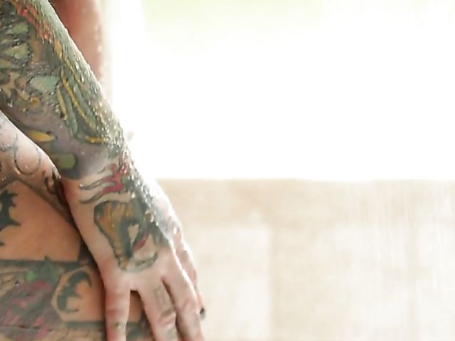 Heavily tattooed busty BBC addict Lily Lane fucks that black sausage and squirts