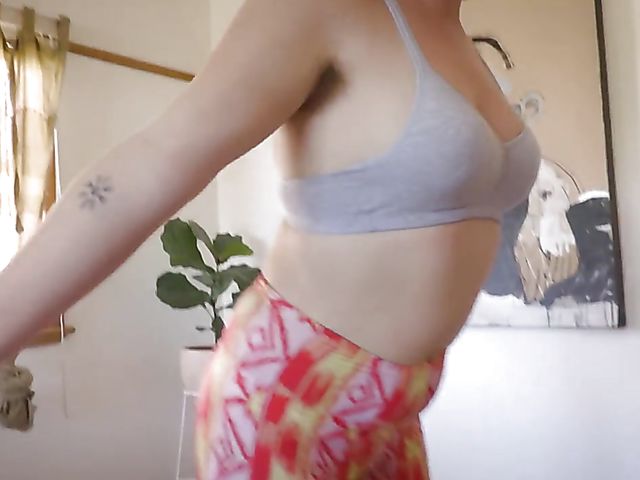 Hairy redhead Kayla Rain doing yoga and masturbating on the floor