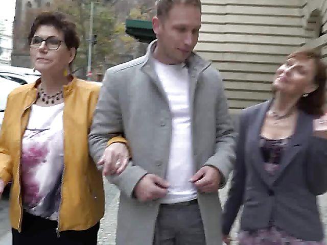 Two mature ladies and a boy have a threesome