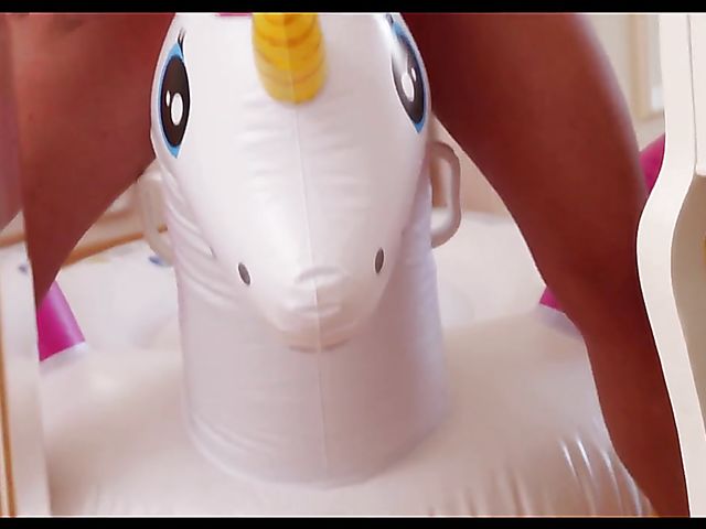 Solo redhead Tiffany Love posing naked with her unicorn and masturbating