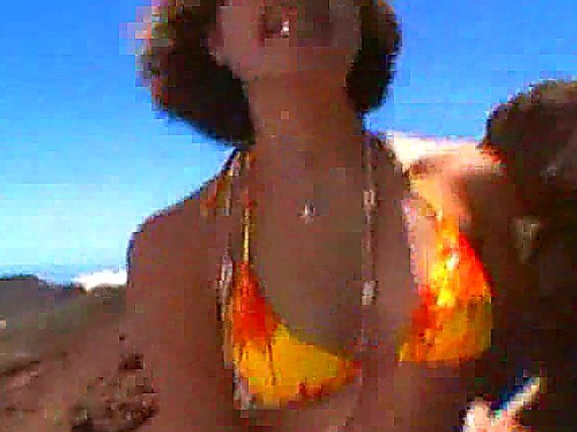 Hot babe fucks her man on the beach