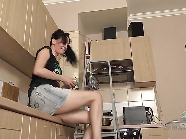 Hairy solo in a mini skirt in the kitchen with skinny Evil Eva