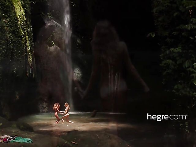 Nude girls Clover and Putri get wet under the waterfall in Bali