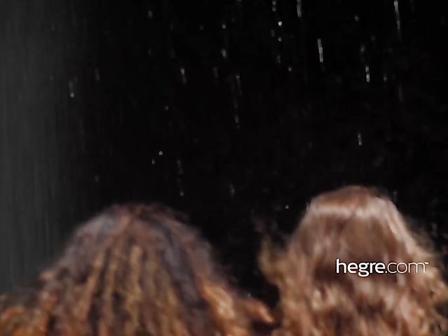 Nude girls Clover and Putri get wet under the waterfall in Bali