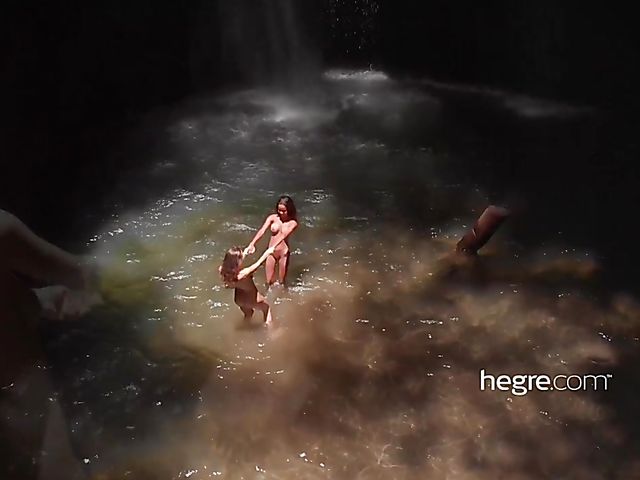 Nude girls Clover and Putri get wet under the waterfall in Bali