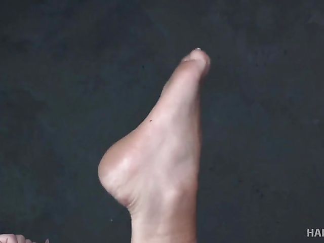 Suspension bondage in the dungeon with Jackie Ohh's tied tits exposed