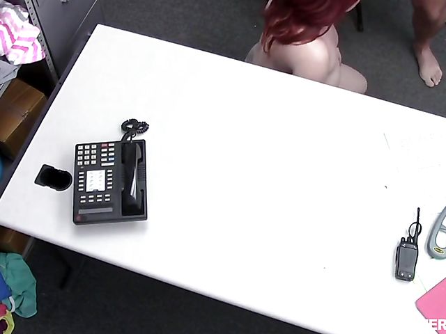 Red head MILF shoplifter Amber Dawn gets nude in front of a security guy and take his cock